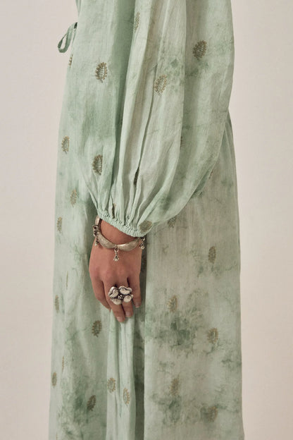 Close-up detail of the Freya Dress in Mineral Waves highlighting the voluminous gathered sleeve, soft tie-dye texture, and delicate paisley motifs.