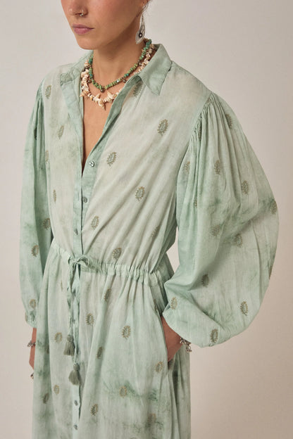Detailed view of the Freya Dress in Mineral Waves highlighting gathered puff sleeves, tasseled drawstring waist, and delicate paisley print.