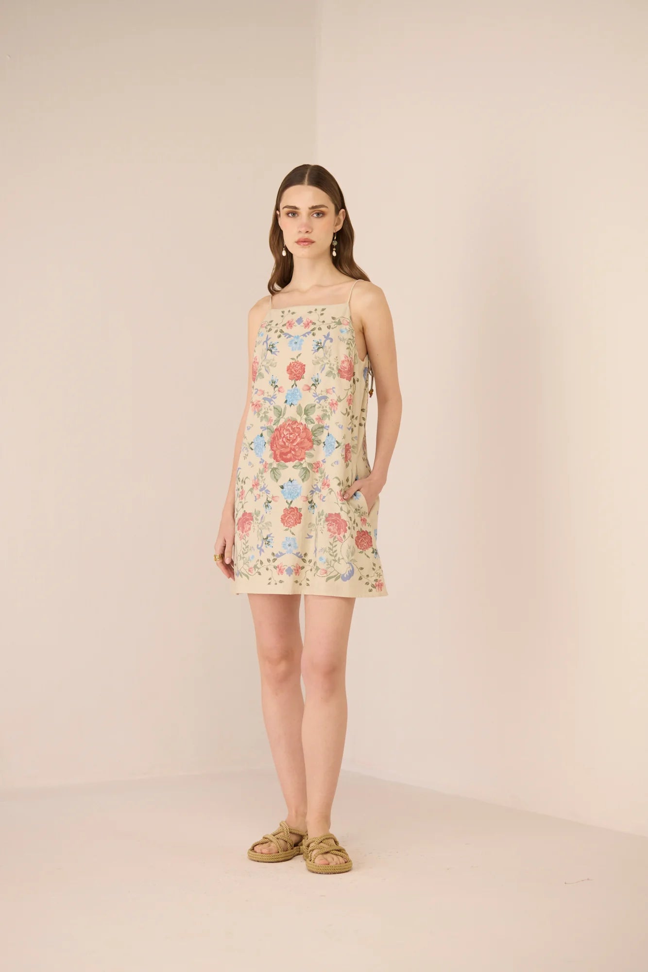 Full-length view of the Gili Mini Dress styled with flat sandals.