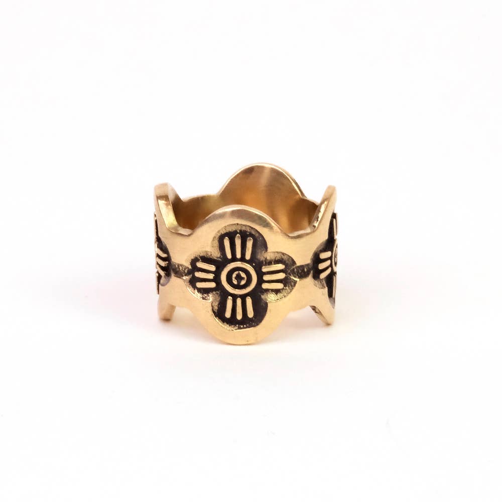 Front view of the Gladys Brass Bandana Slide Ring showing floral detailing and scalloped edges on a white background.