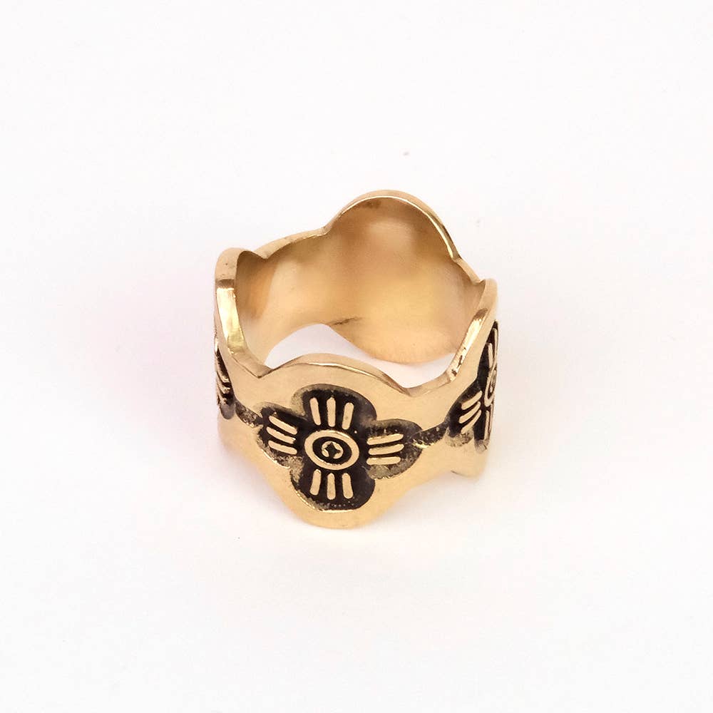 Side view of the Gladys Brass Bandana Slide Ring showing its open slide shape and floral design.