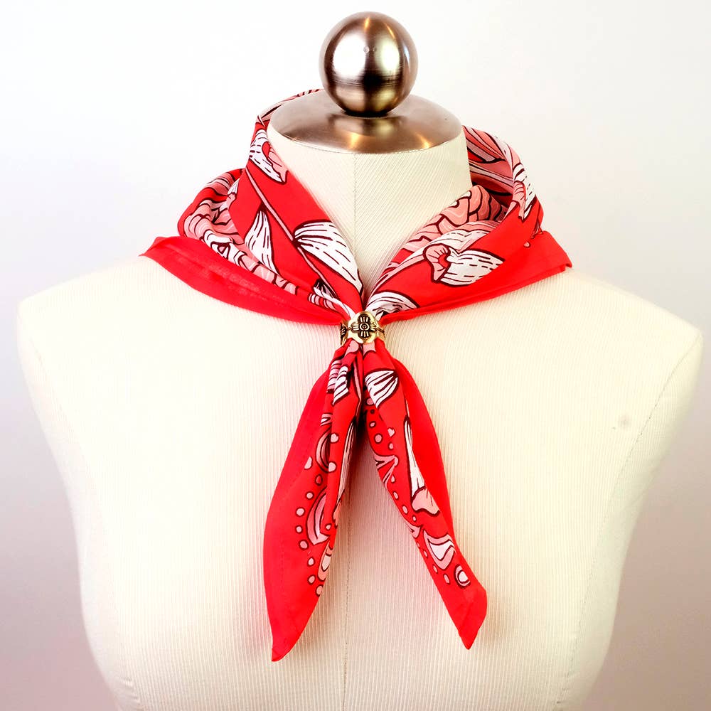 Gladys Brass Bandana Slide Ring styled on a red bandana around a mannequin neck.