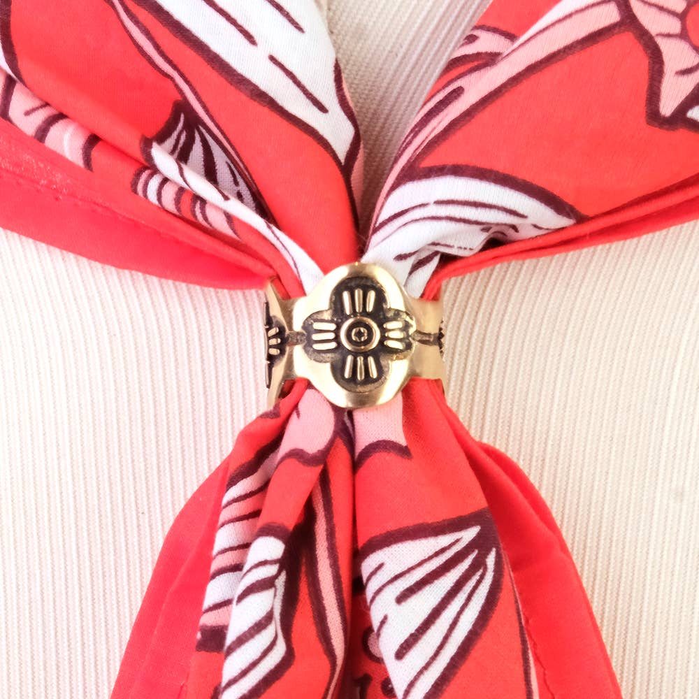 Gladys Brass Bandana Slide Ring securing a red floral bandana for a polished scarf-style look.