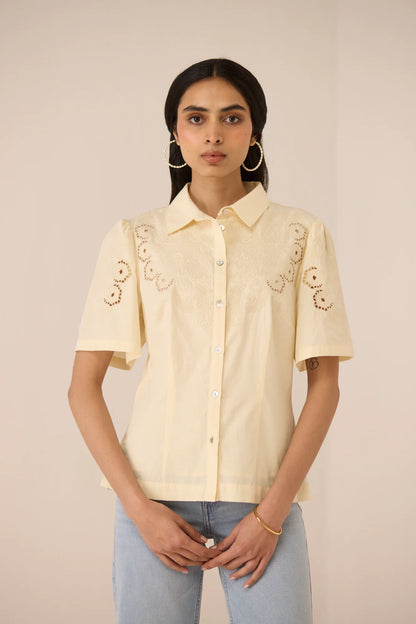Hartley Shirt styled with light blue jeans, featuring botanical embroidery on the yoke and sleeves.