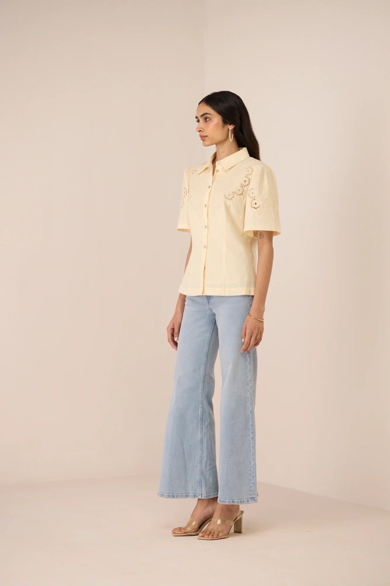 Side view of the Hartley Shirt styled with light blue jeans for an elevated everyday look.