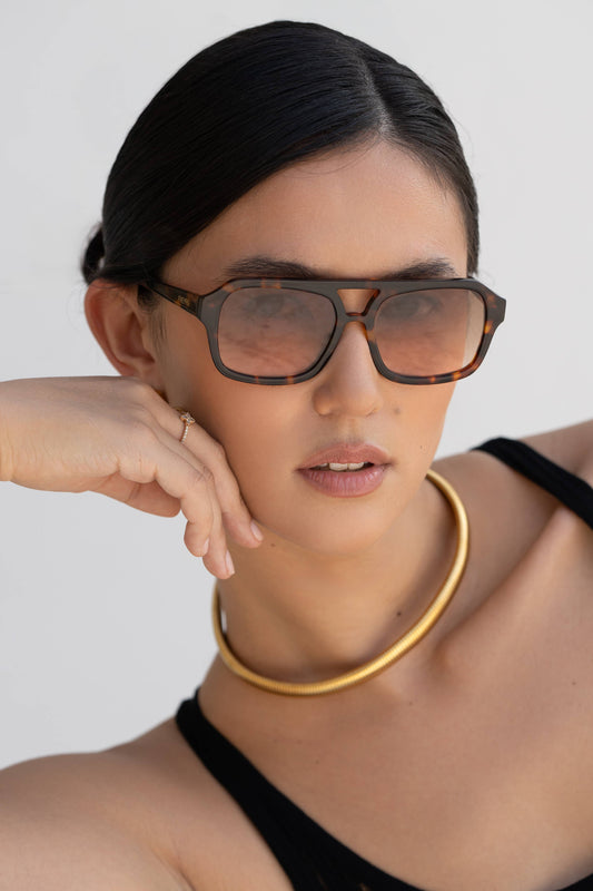 Model wearing Havana Acetate Aviator Sunglasses with tortoise frames and brown lenses.