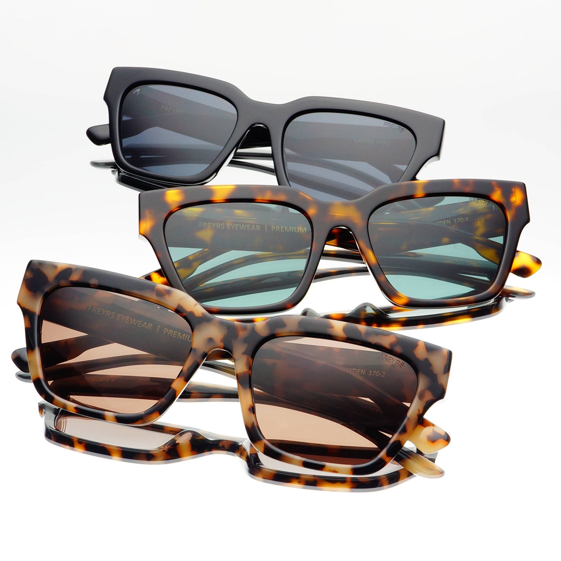 Three Hayden rectangular sunglasses displayed together, showcasing multiple acetate colorways including Milky Tortoise, Matte Black, and Tortoise with premium lenses.