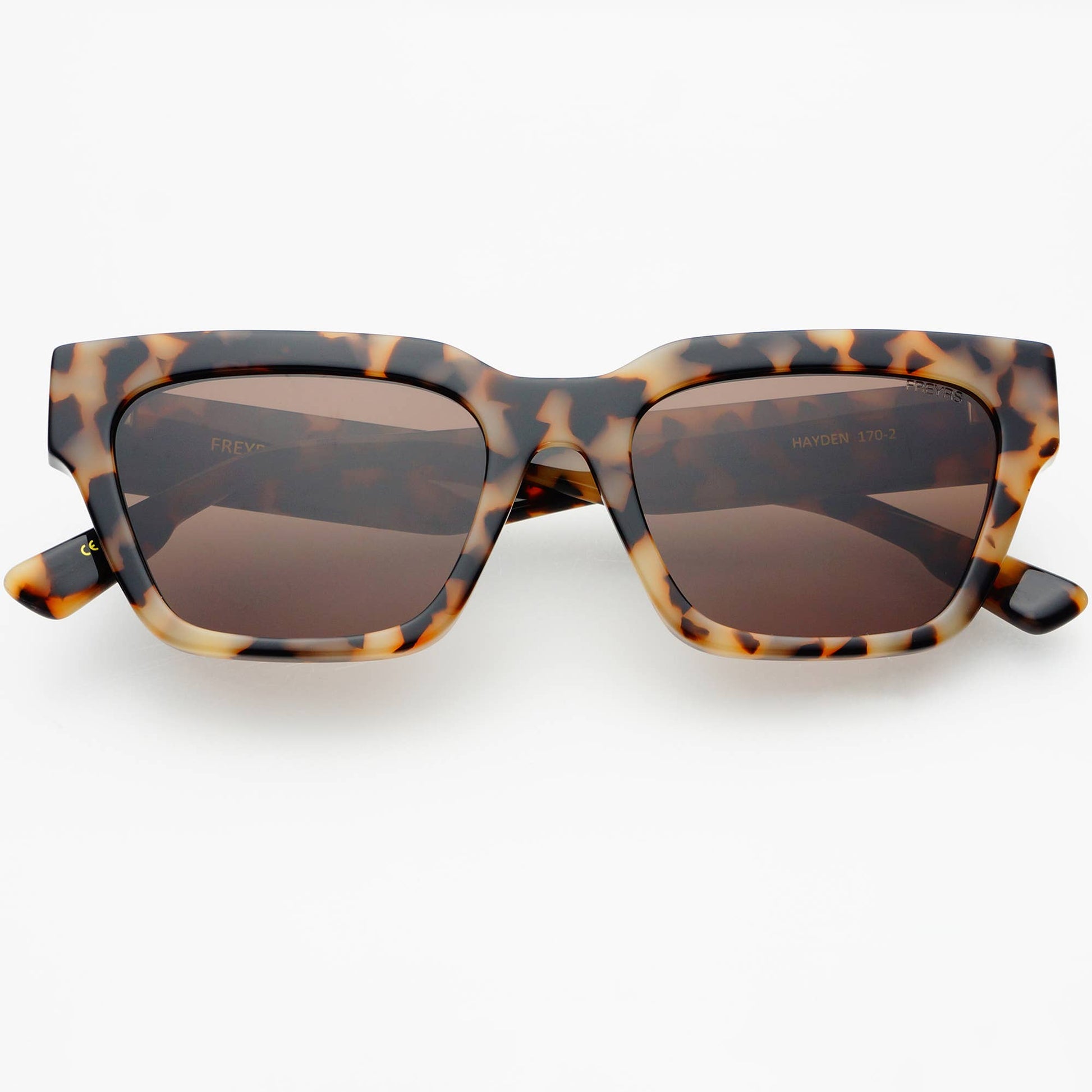 Front view of Hayden acetate rectangular sunglasses in Milky Tortoise with brown CR39 lenses, featuring a bold angular frame and medium-fit design.