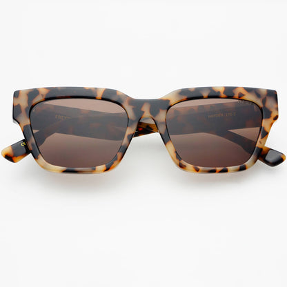 Front view of Hayden acetate rectangular sunglasses in Milky Tortoise with brown CR39 lenses, featuring a bold angular frame and medium-fit design.