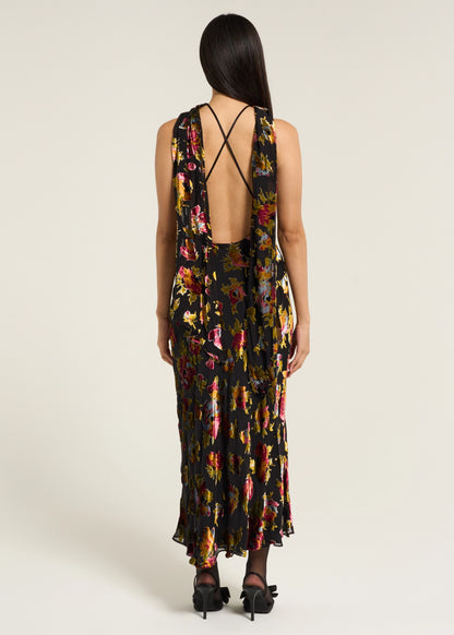 Back view of the Hayley Dress in Countryside Devoré Black with an open back design, delicate cross straps, and flowing floral devoré fabric.