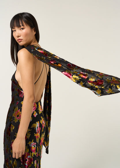Close-up side view of the Hayley Dress in Countryside Devoré Black highlighting the flowing scarf extension and metallic floral devoré texture.