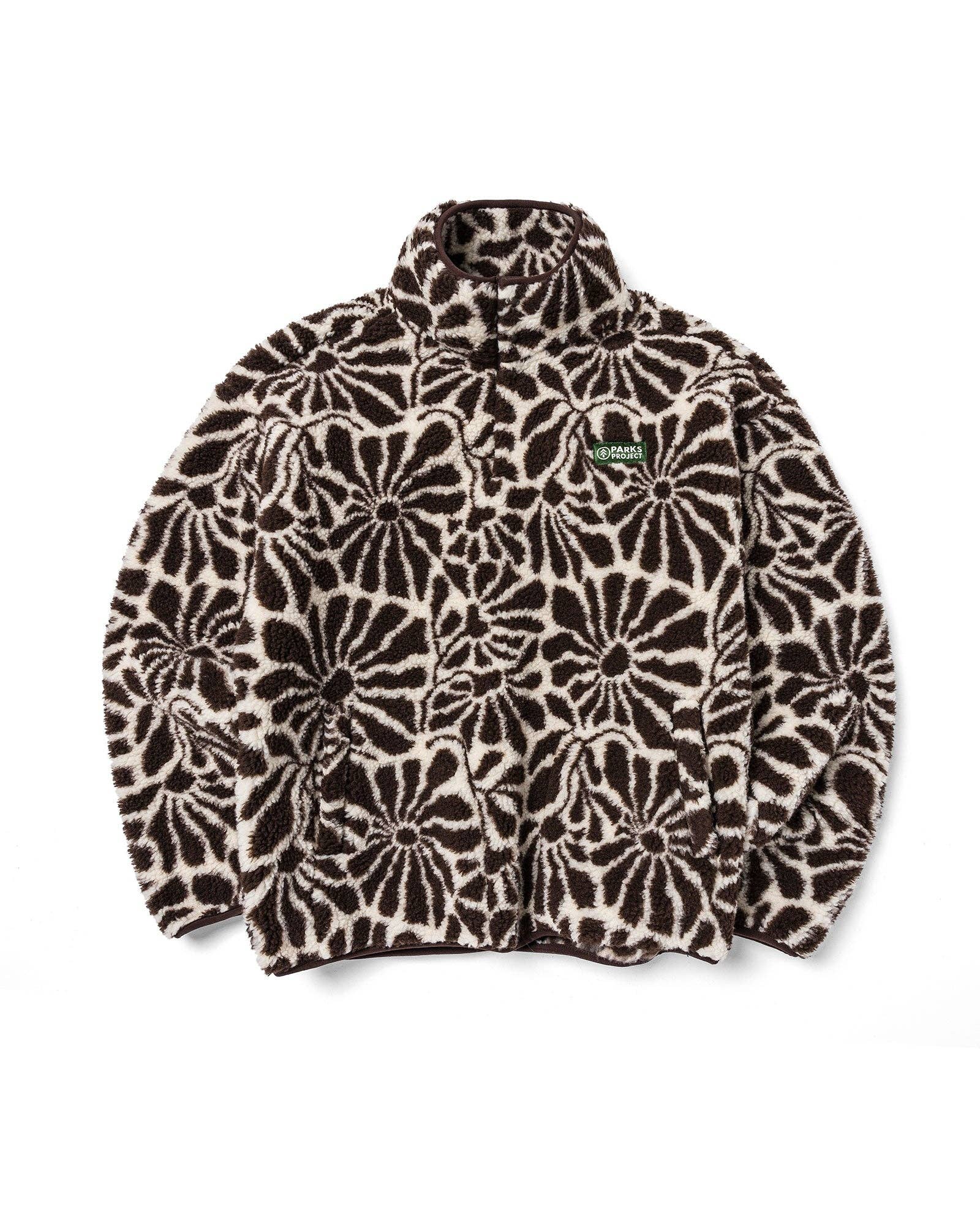 Front view of the brown and natural High Desert Wildflowers high-pile fleece with an allover floral print, high collar, snap placket, front pockets, elastic cuffs, and gathered hem.