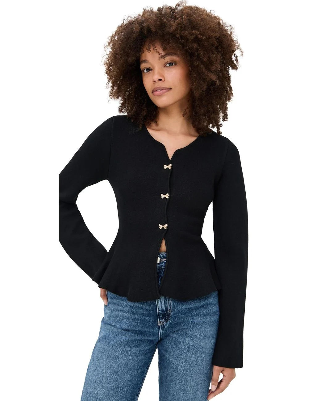 Front view of the black Idah Cardigan with a deep V-neckline, gold-tone bow buttons, and peplum silhouette.