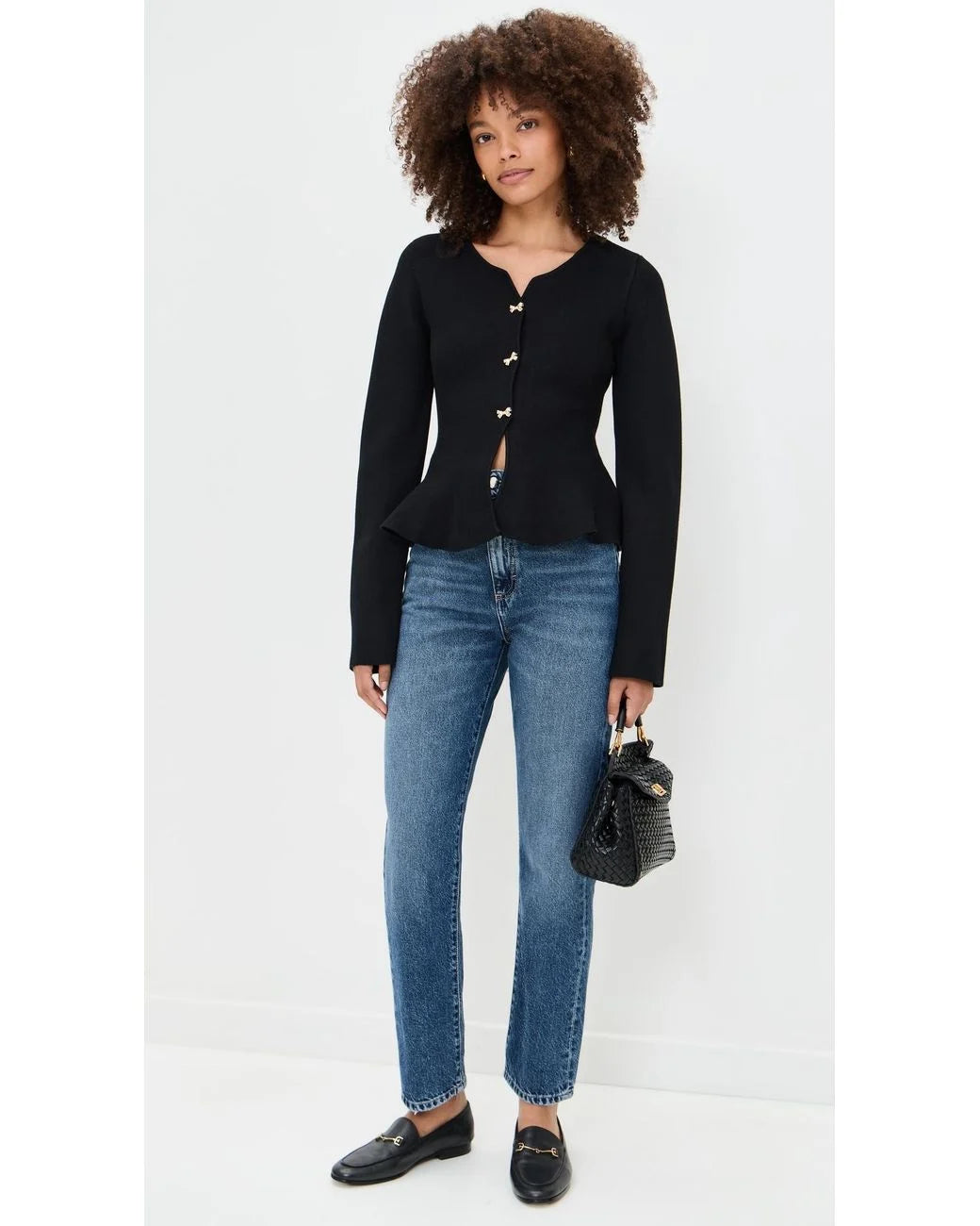 Idah Cardigan styled with blue straight-leg jeans and black loafers.