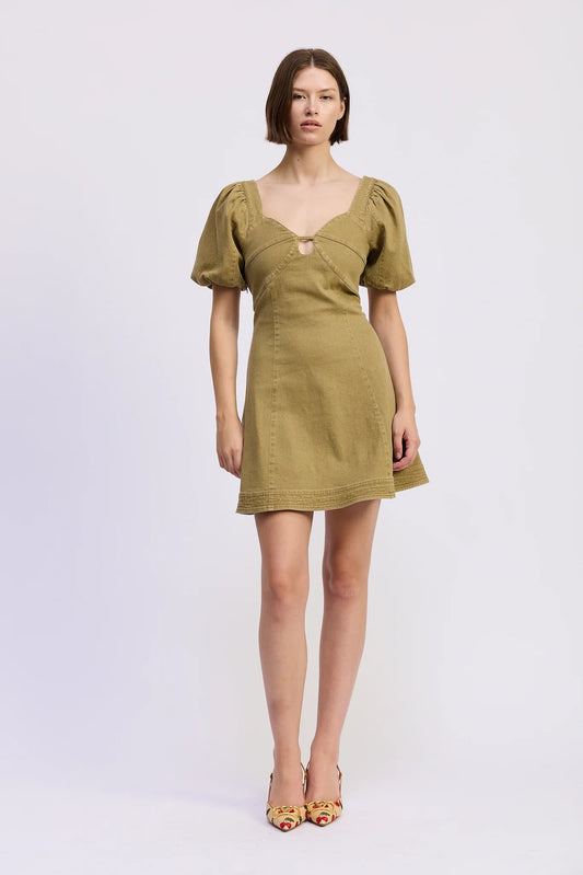 Model wearing the Isabelle Mini Dress in olive green featuring a sweetheart neckline with front cut-out detail, puff sleeves, fitted bodice, and flared A-line mini skirt.