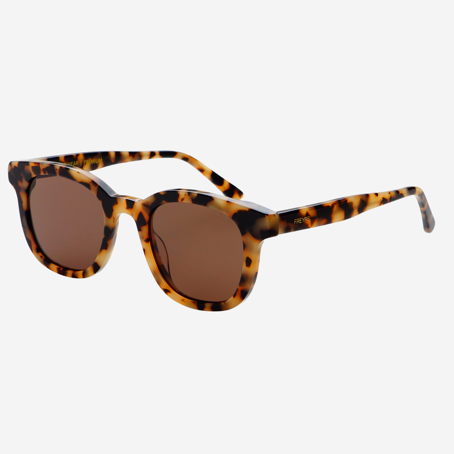 Handmade tortoise acetate rectangular sunglasses with brown nylon lenses shown at an angle.