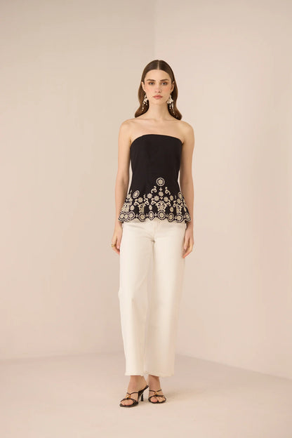 Kaia Tube Top in black styled with white trousers for a polished day-to-evening look.