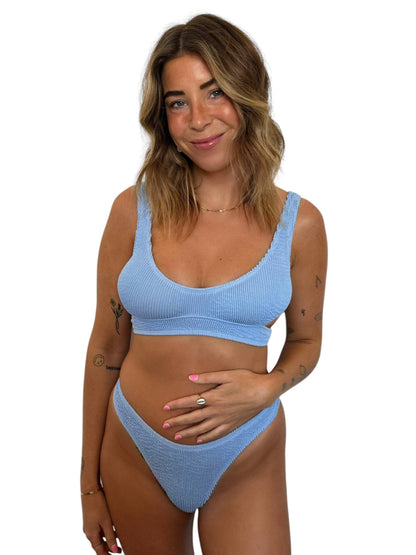 Model wearing the Kiera Top in Orchid with a matching ribbed bikini bottom.