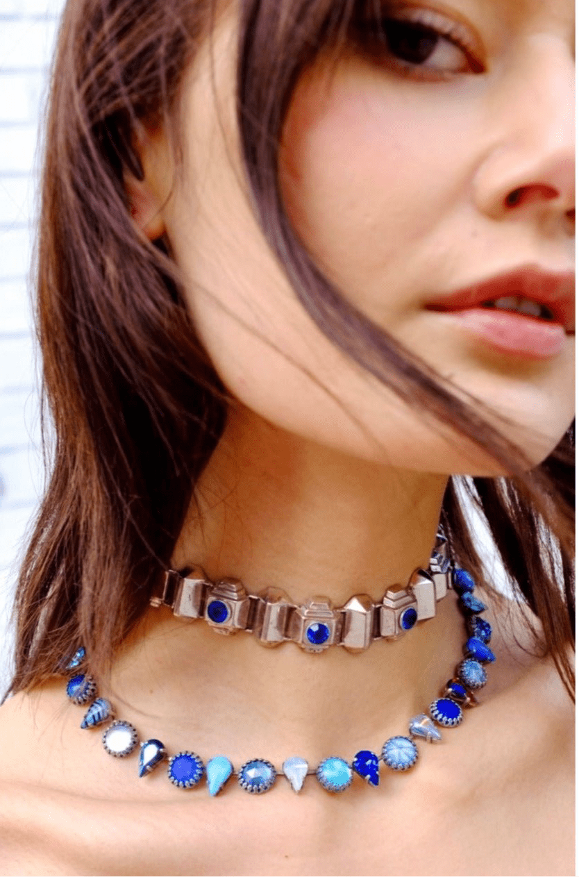 Close-up of the Layering Choker in Ocean Silver with ocean blue glass stones and silver-plated settings.