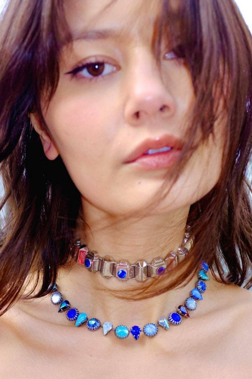 Model wearing the Layering Choker in Ocean Silver with blue vintage glass stones and silver-plated settings.