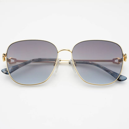 Front view of Lea women's round sunglasses featuring a gold-tone stainless steel frame, gradient gray lenses, adjustable nose pads, and acetate temple tips.