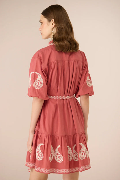 Back view of the Lizzie Mini Dress showing the relaxed fit, matching embroidered belt, and cream embroidery along the sleeves and hem.
