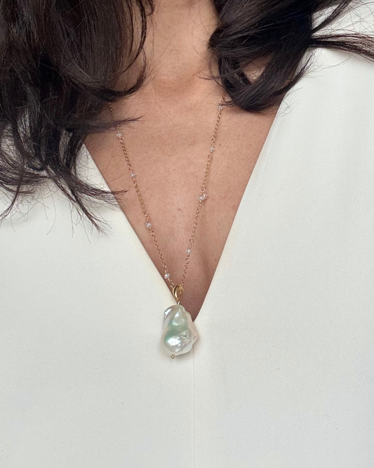 Model wearing the Long White Baroque Pearl Necklace + Herkimer Diamonds with a delicate gold-plated chain