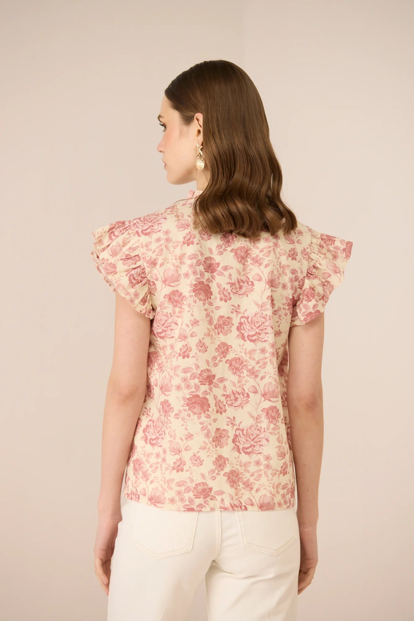 Close back view of the Madison Blouse highlighting the frill sleeves and soft botanical print.