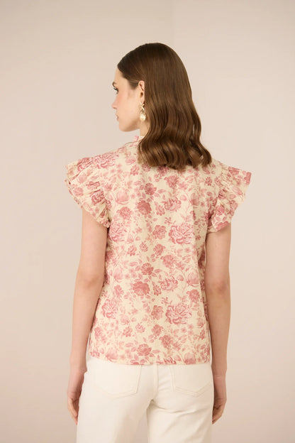 Close back view of the Madison Blouse highlighting the frill sleeves and soft botanical print.