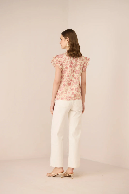Side view of the Madison Blouse showing the relaxed fit, frill sleeves, and soft floral print.