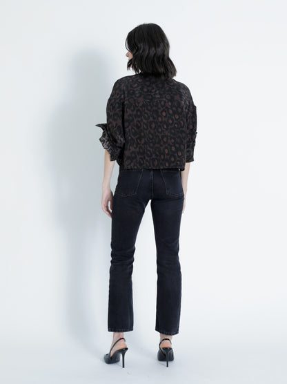 Full-length view of the Malaga Print Shirt paired with dark denim jeans and black heels for an effortless everyday look.