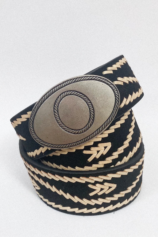 Rolled view of the Malambo Belt highlighting the black woven strap, cream stitching, and antiqued silver-tone oval buckle.