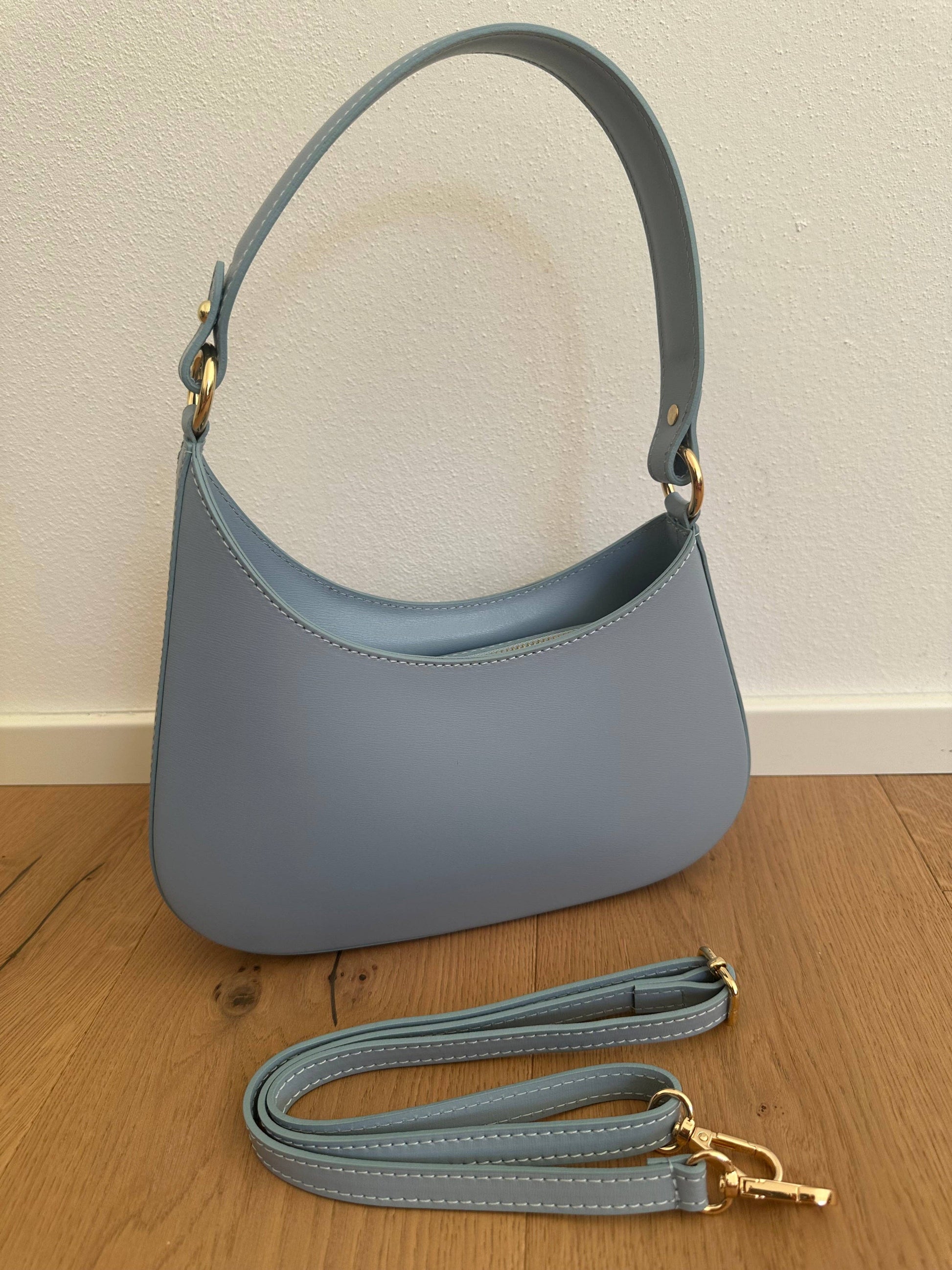 Baby blue genuine leather Margaret shoulder bag with gold-tone hardware, top handle, and adjustable crossbody strap.