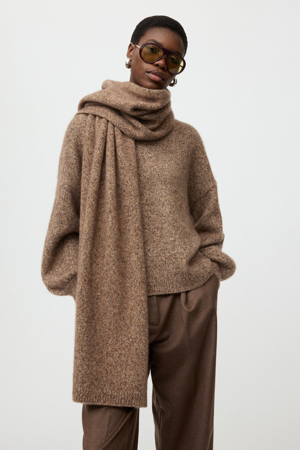 Close-up of the brown melange Marled Scarf showing its soft marled knit texture and draped styling.
