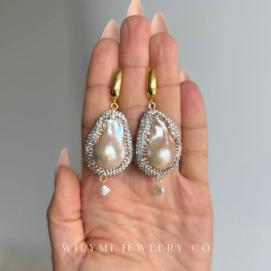 Matching Baroque & Crystal Earrings with luminous pearls, crystal detailing, and gold-filled hooks displayed on a hand