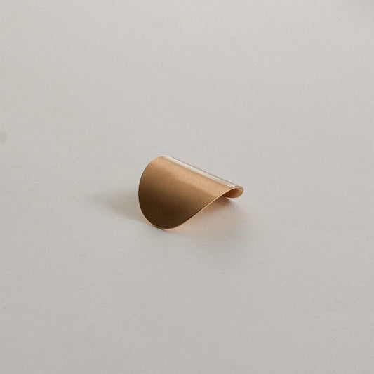 Gold oval metal ponytail cuff stick shown from the front on a neutral background.
