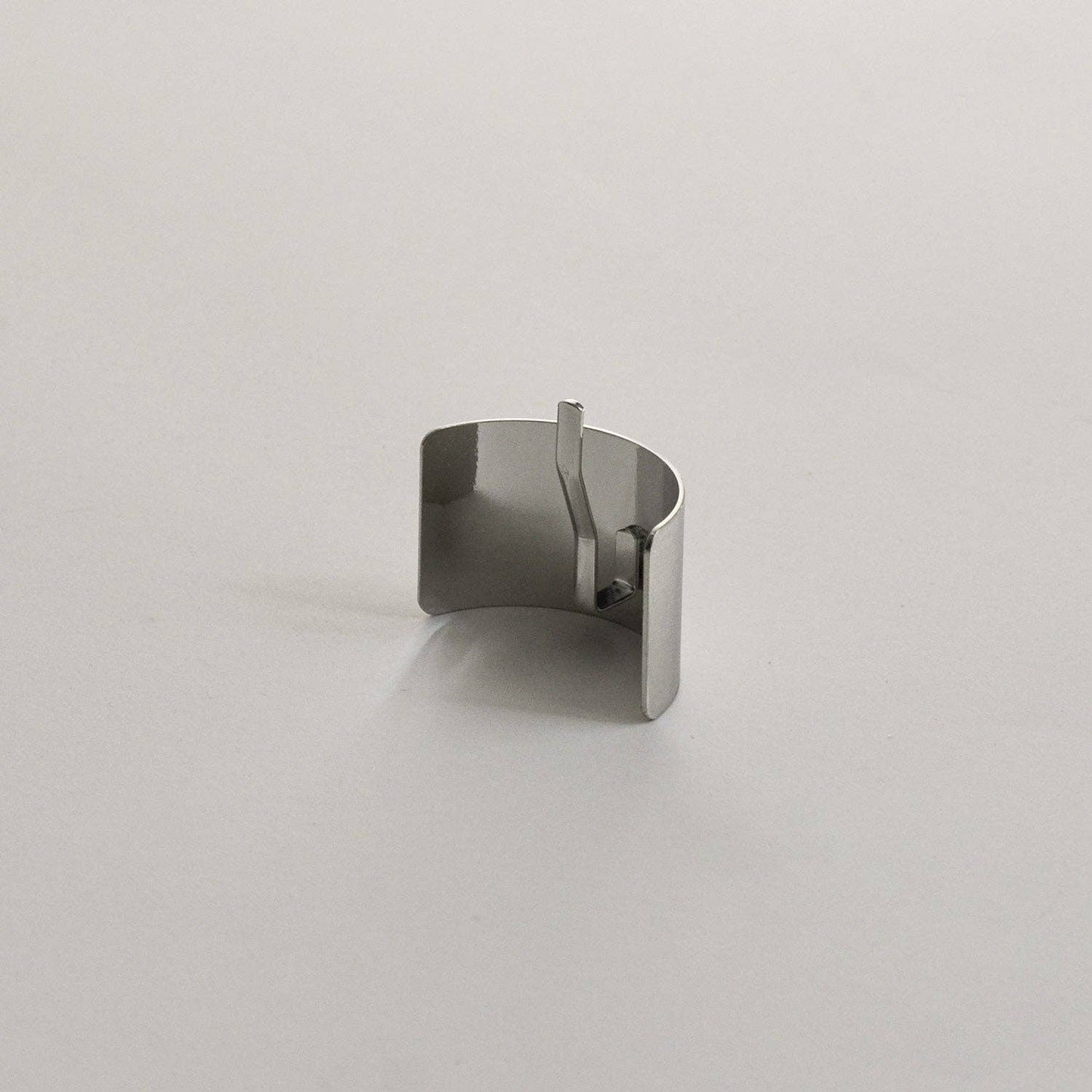 Back view of the silver rectangular metal ponytail cuff stick showing the built-in fastening stick.