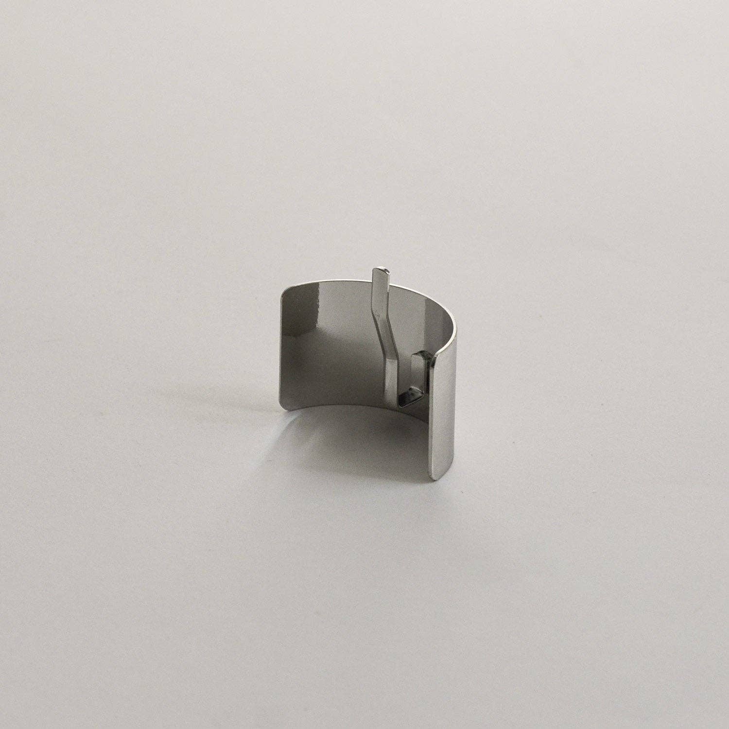 Back view of the silver rectangular metal ponytail cuff stick showing the built-in fastening stick.