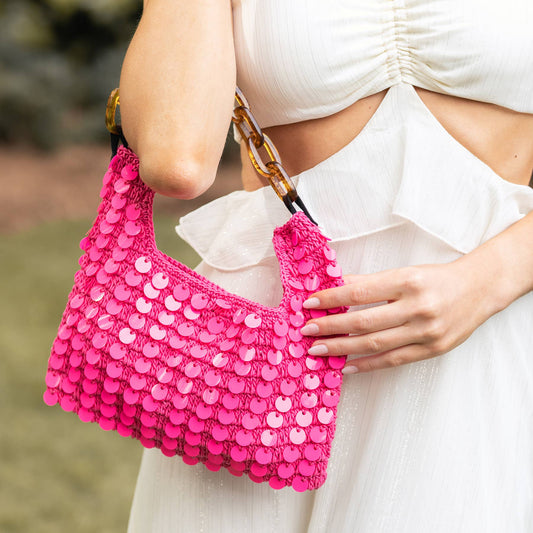Close-up of the Mia Cotton Purse with Pink Sequins & Chain Handle showcasing hand-crocheted cotton craftsmanship, glossy pink sequin embellishments, and an acrylic chain shoulder handle.