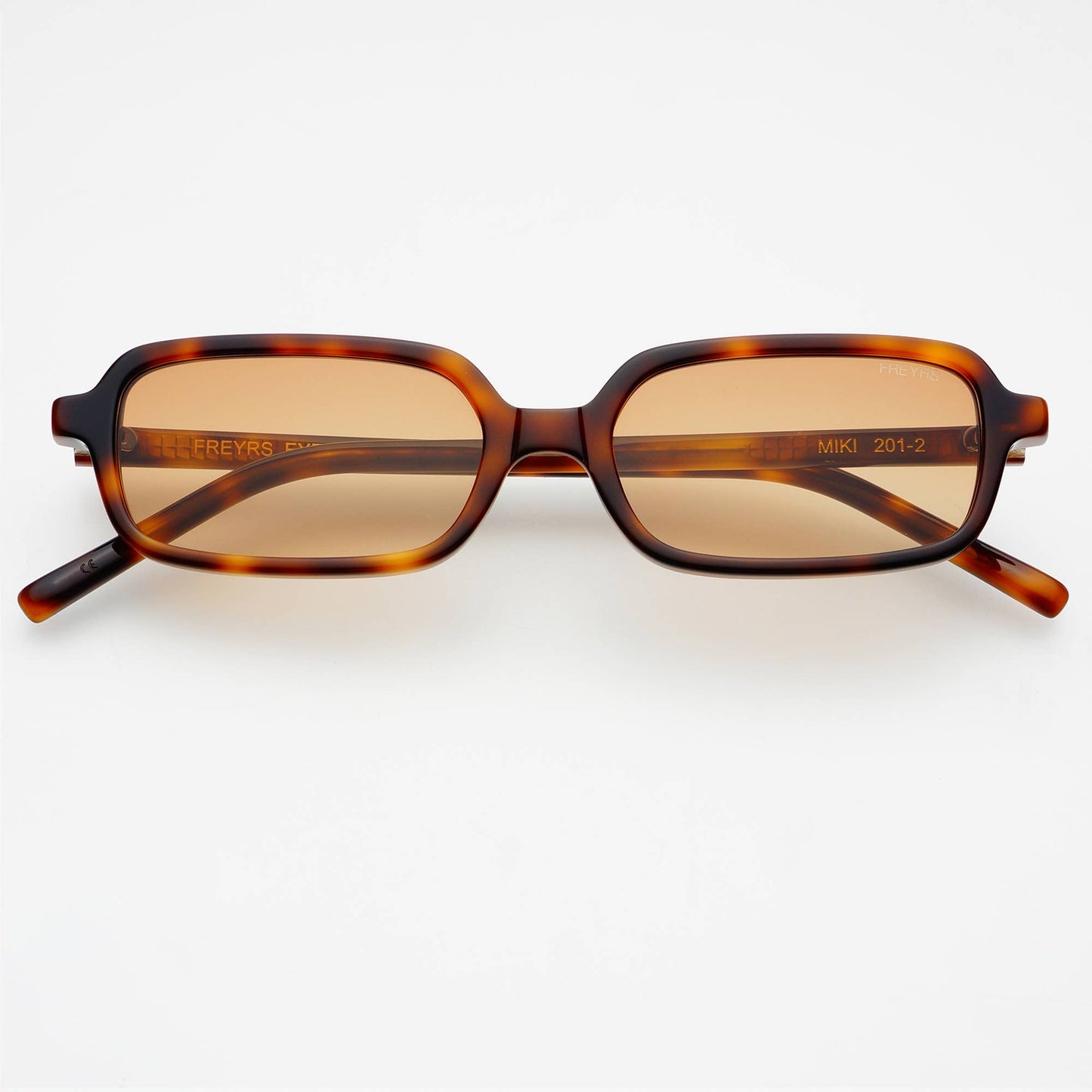 Front view of Miki rectangular unisex sunglasses featuring a tortoise acetate frame and brown UV-protective lenses.