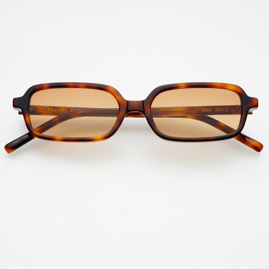 Front view of Miki rectangular unisex sunglasses featuring a tortoise acetate frame and brown UV-protective lenses.