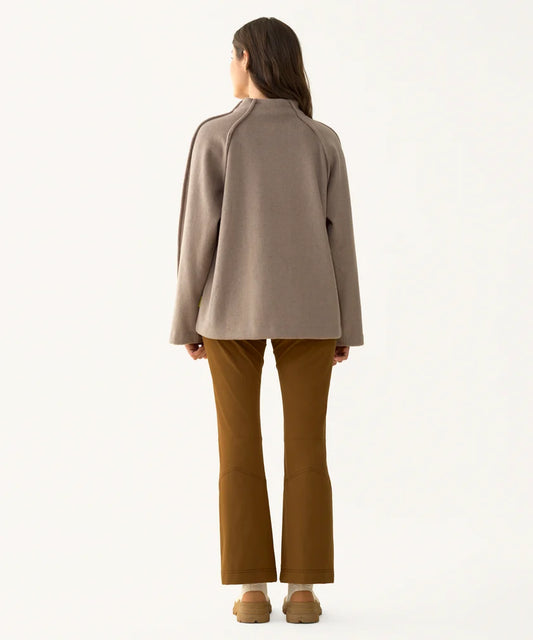 Model wearing the Hikerkind Mock Neck Pile Fleece from the back, showing the relaxed silhouette, mock neckline, and long sleeves.