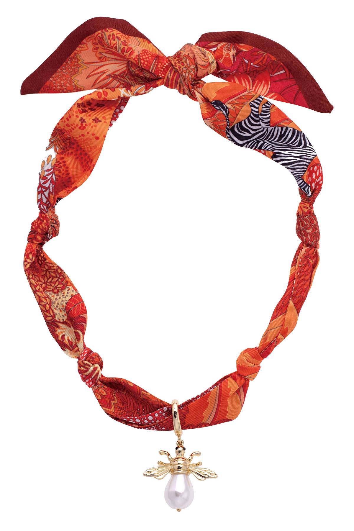 Monroe Pearl Bumble Bee Scarf Necklace in Orange/Red featuring a patterned orange and red scarf necklace with a gold bumble bee charm and pearl drop accent.