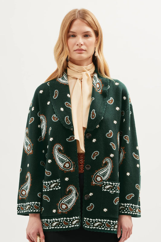 Front view of the Morla Cardigan in green featuring an intricate paisley print, V-neckline, single-button closure, and integrated patch pockets with contrasting trim details.