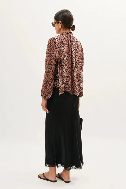 Back view of the Moss leopard print silk blouse with relaxed fit and long sleeves
