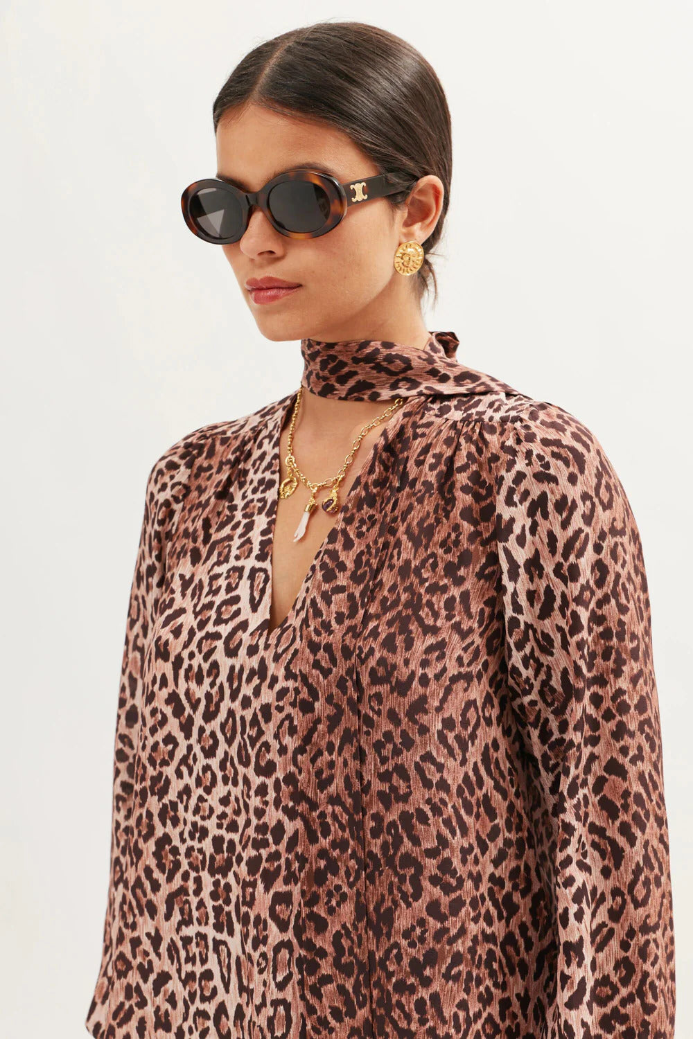 Side close-up of the Moss leopard print silk blouse with gathered shoulders and soft drape