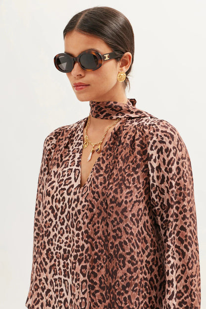 Side close-up of the Moss leopard print silk blouse with gathered shoulders and soft drape
