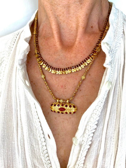 Full styling view of a woman wearing the Mumbai Necklace with a textured white blouse.