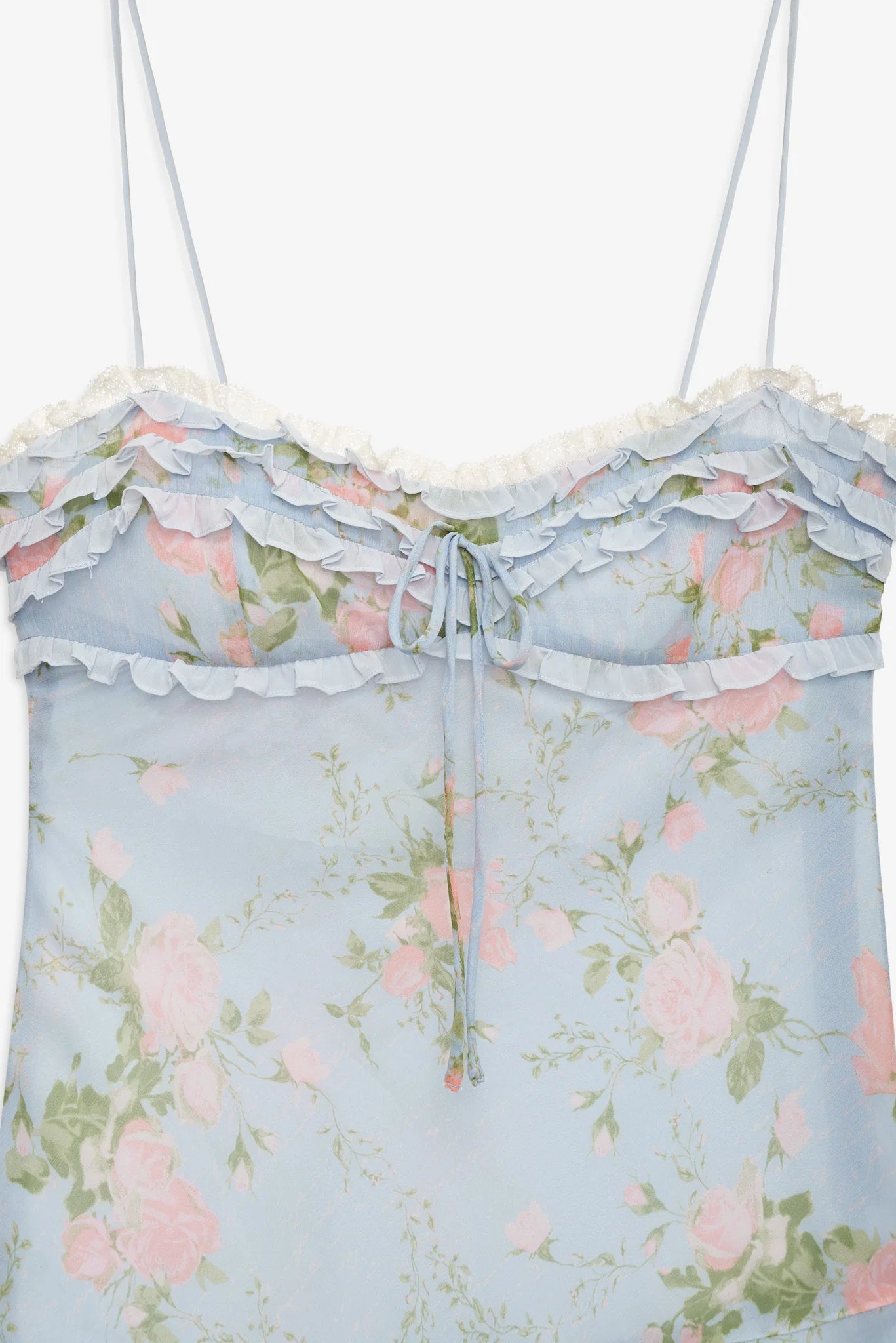 Close-up of the Natalie Maxi Dress featuring layered ruffle detailing, lace trim, floral print, and adjustable front tie at the bodice.