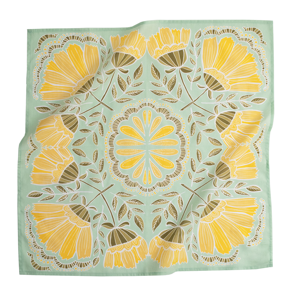 No. 044 Hazel Bandana laid flat, featuring bright yellow flowers and olive leaves on a light green background.